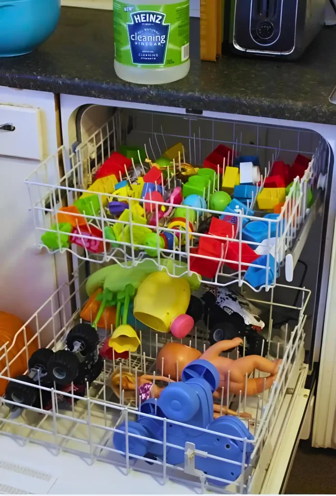 a dishwasher filled with lots of colorful toys