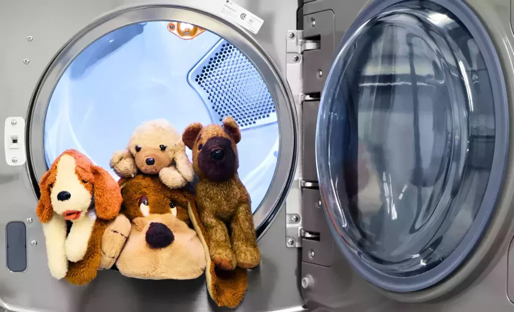 a washing machine with stuffed animals inside of it